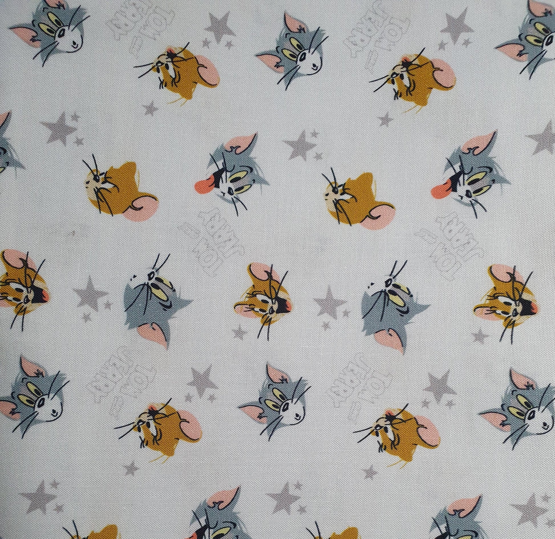 Tom and Jerry Cotton Print - Character Heads and Stars on White